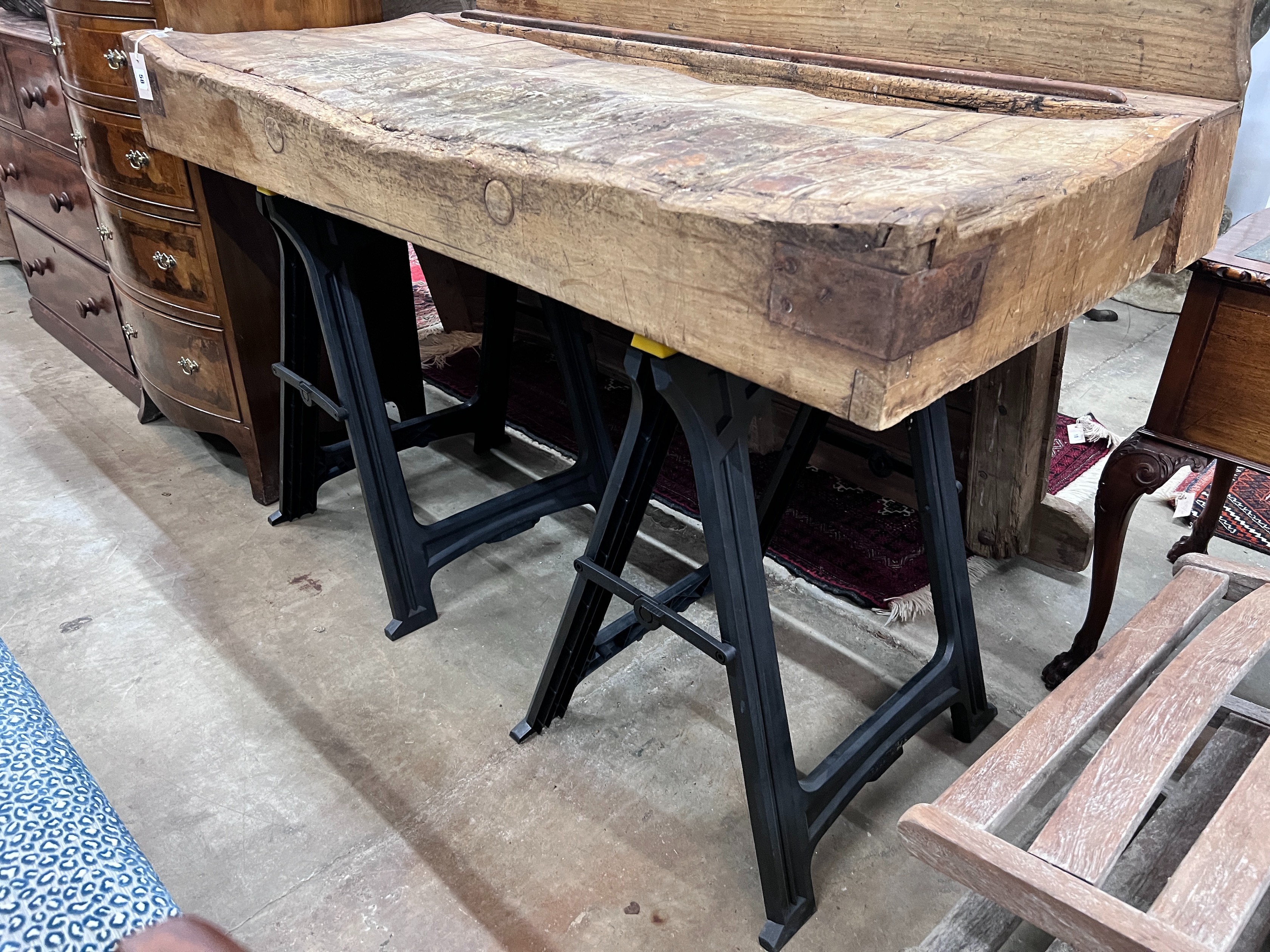 A Victorian butcher's block on modern trestle base, width 162cm, depth 76cm, height 126cm *Please note the sale commences at 9am.